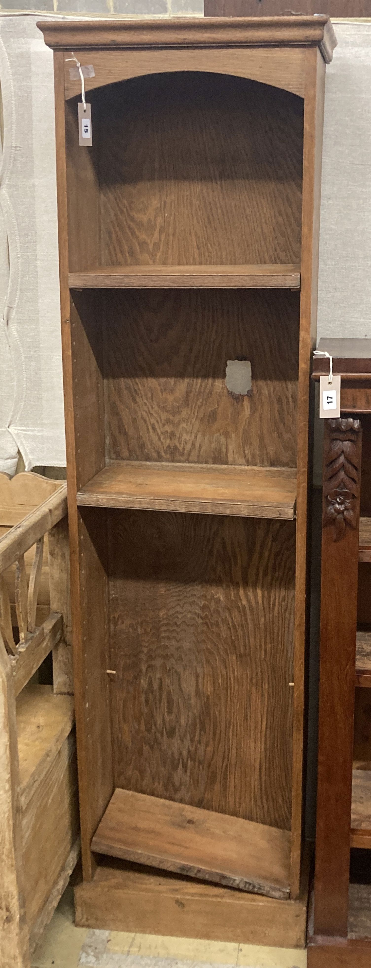 A narrow oak and pine open bookcase, length 49cm, depth 23cm, height 176cm